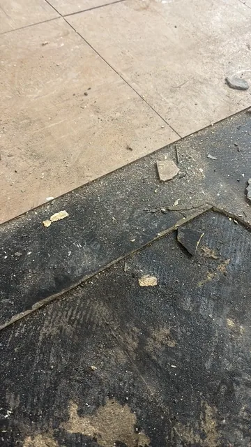 Black bitumen mastic floor removal in a SW4 flat
